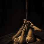 Molly Dolly tied to Bamboo in shibari bondage