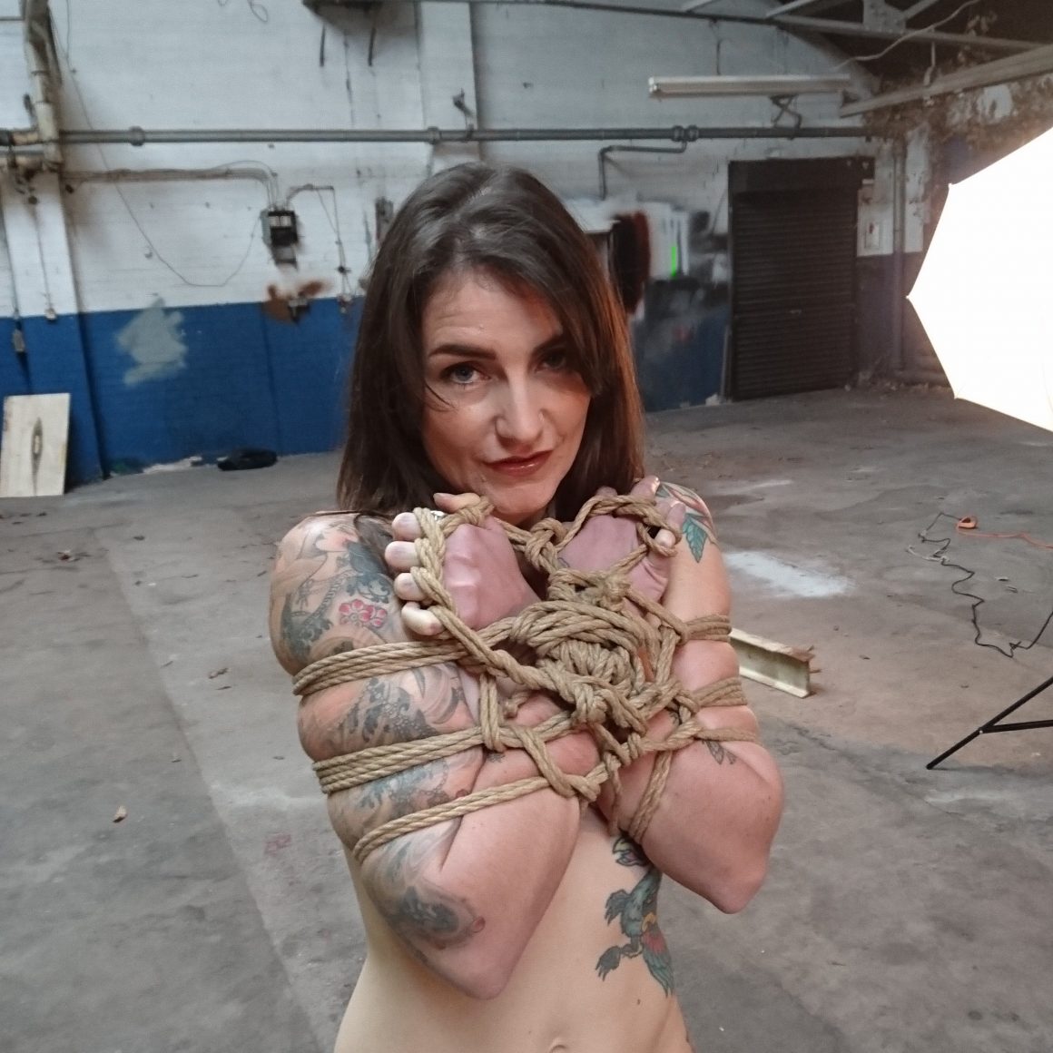 Adreena @adreena_winters looking cute while tied during our rope bondage porn shoot to Hustler's Taboo magazine. #rope #shibari #bondage #porn #tattoos #tattoedgirl
